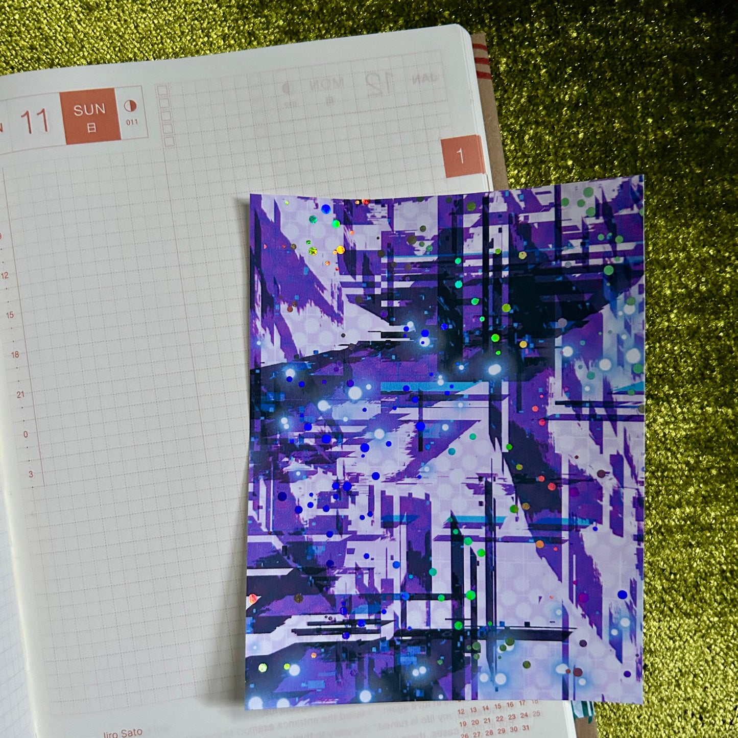 Notebook with a colorful abstract design on top of it