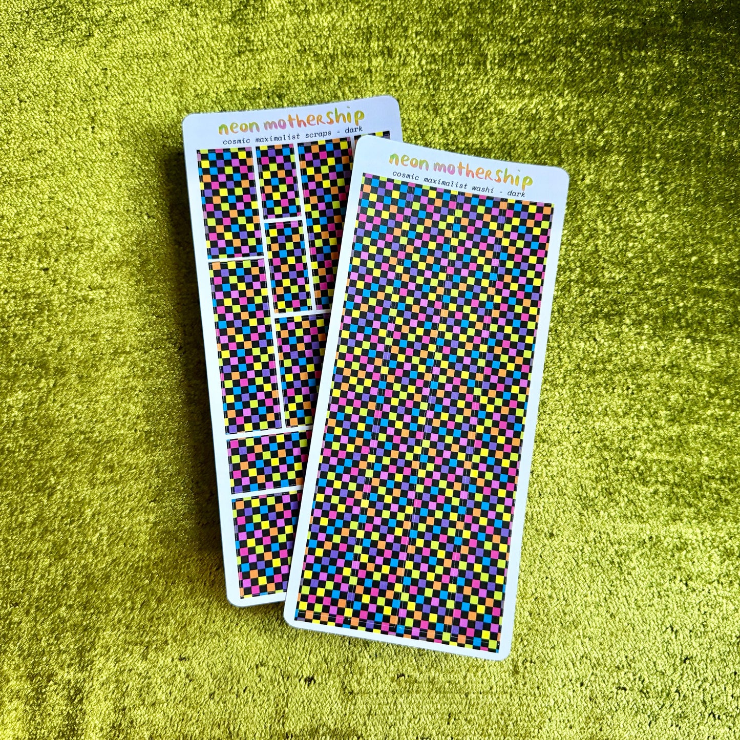 two checkered sticker sheets on a green background