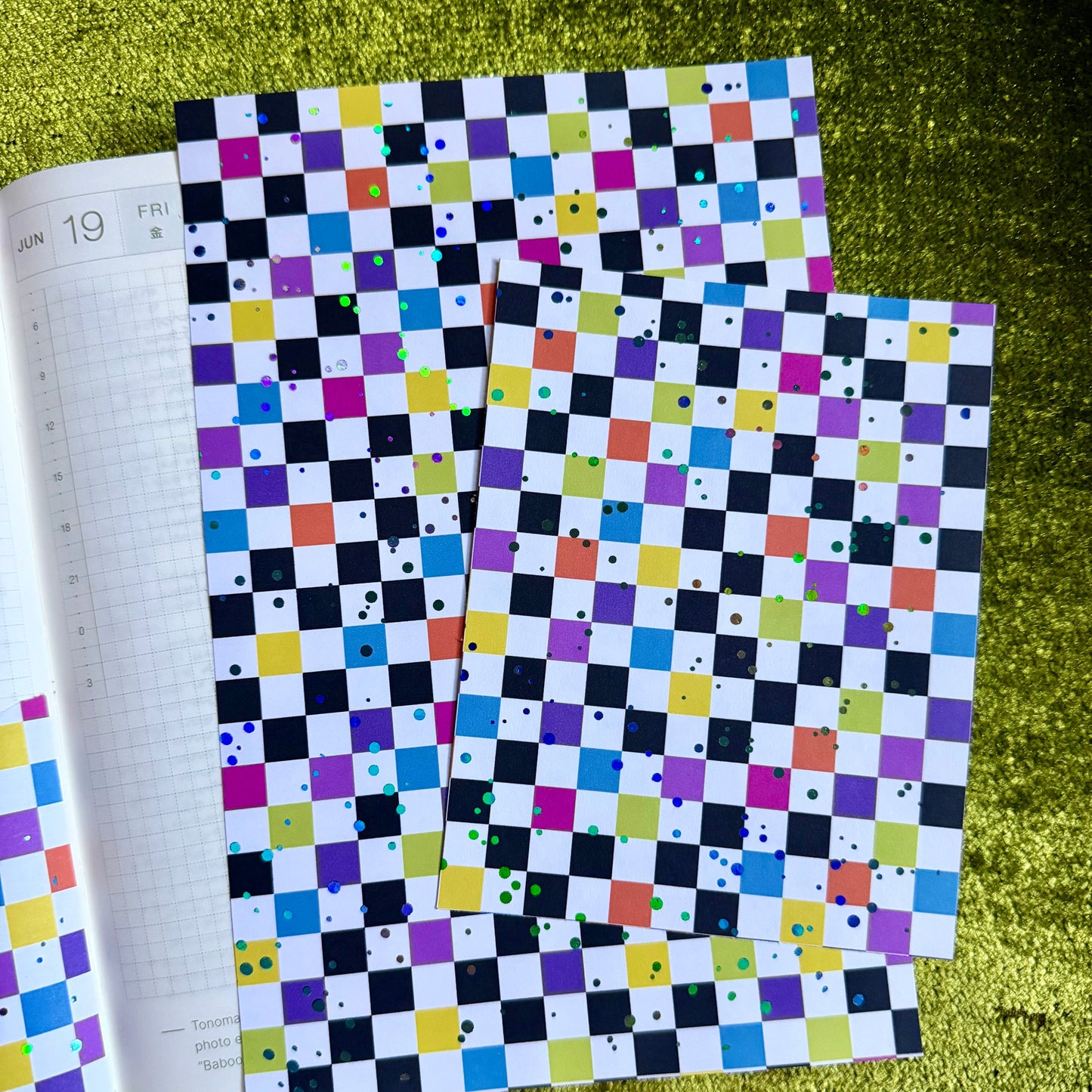 two sheets of checkered sticker paper on a journal page