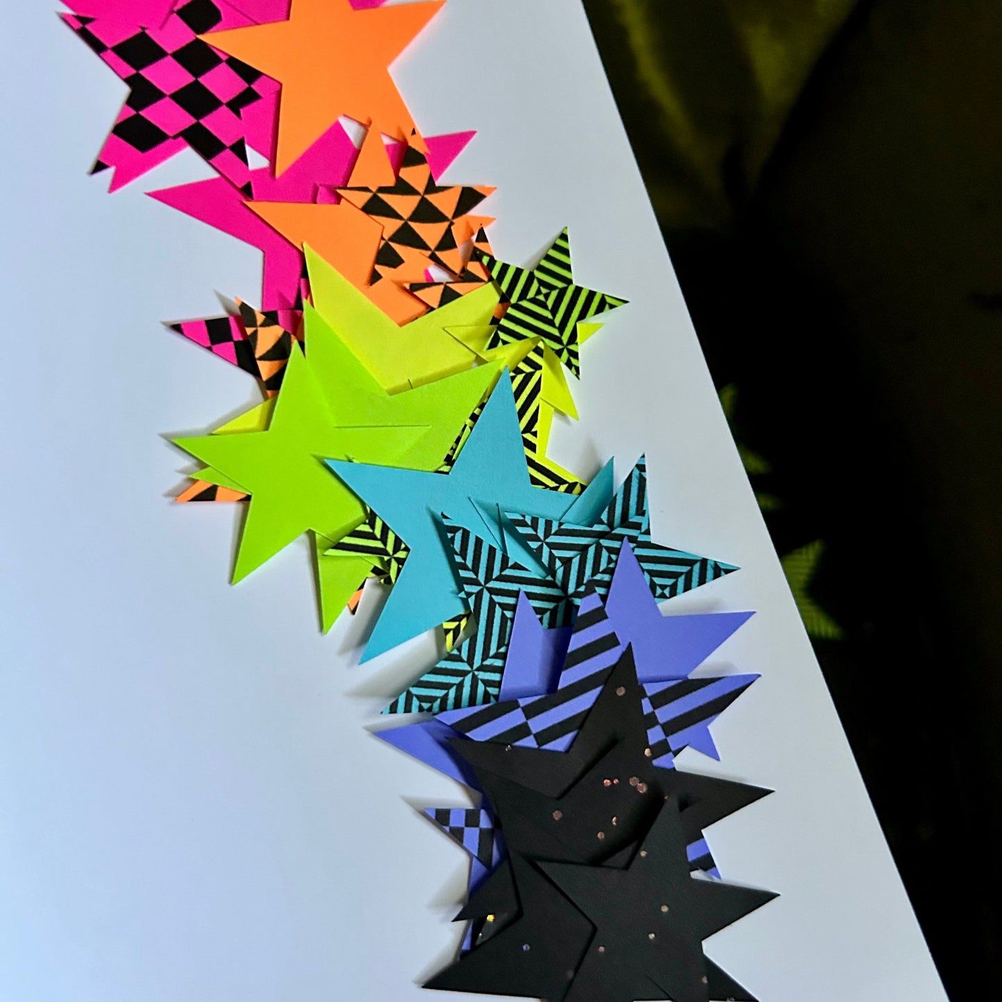Colorful star-shaped cutouts on a white background