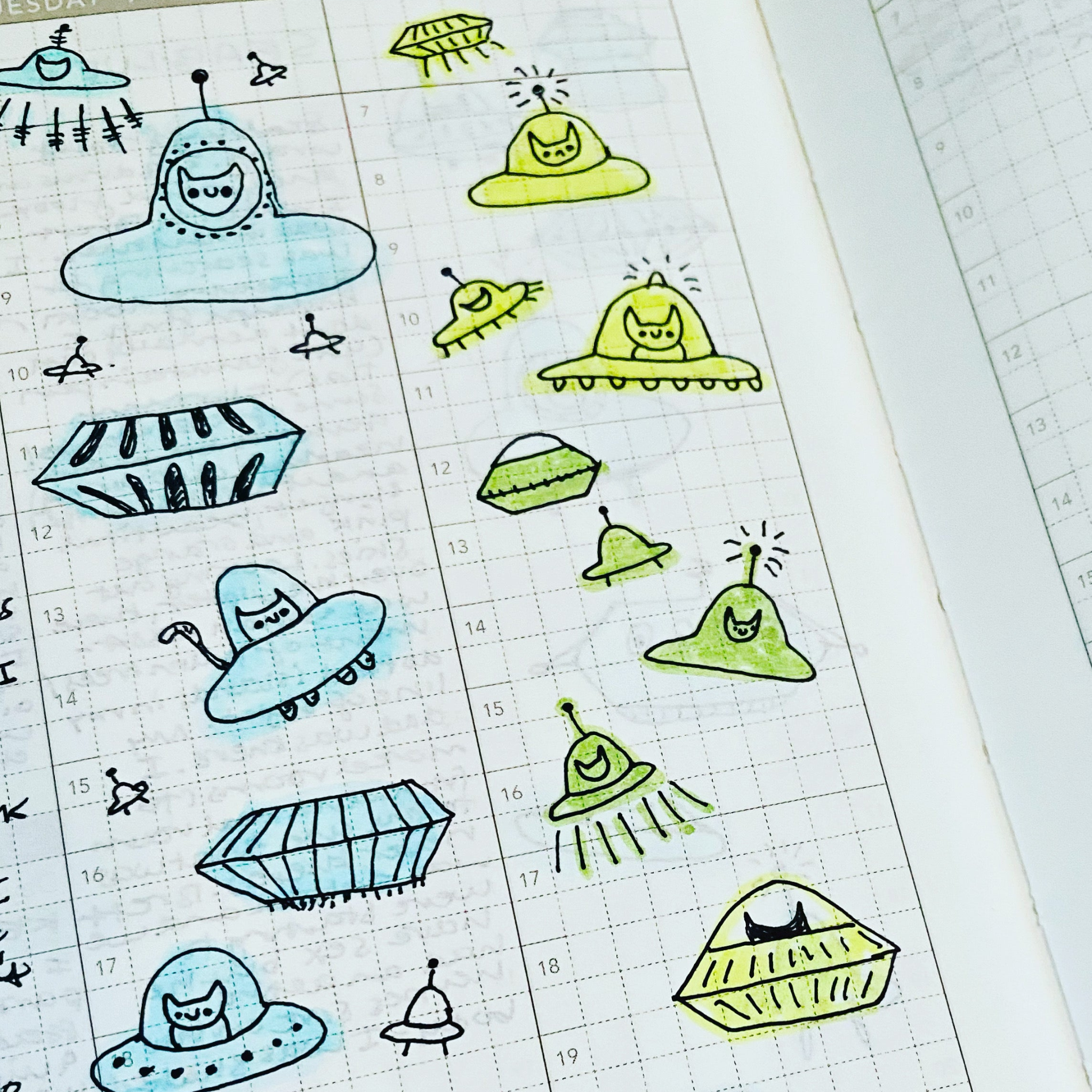 Sticker sheet with alien and UFO designs on a grid background