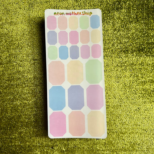 Pack of colorful stickers labeled 'neon motherhip' on a green textured background