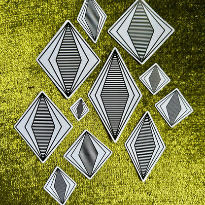 Black geometric shapes on a textured green background