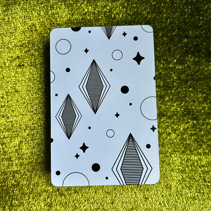 art print with geometric pattern on a green textured surface