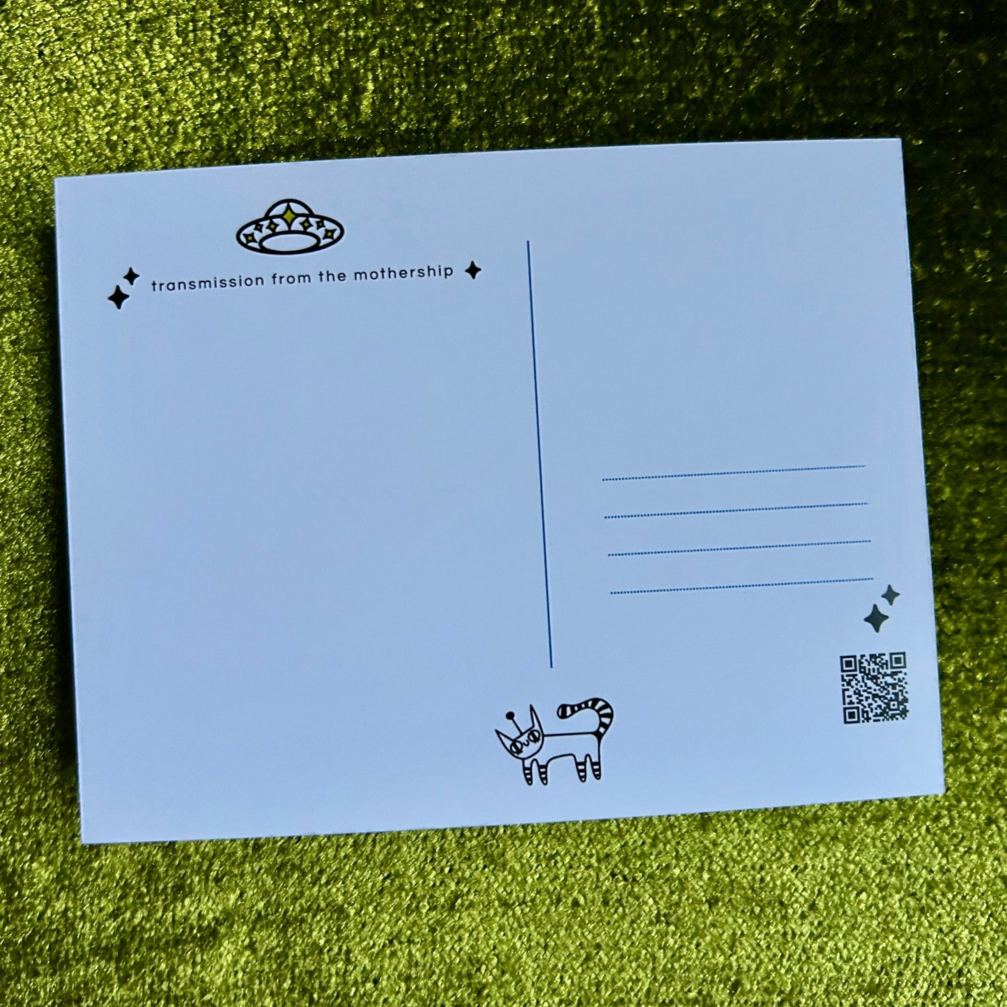 postcard with black text and illustrations on a green grass background