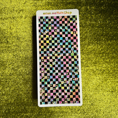 Checkered patterned sticker sheet with 'neon mothership' text on a green textured background