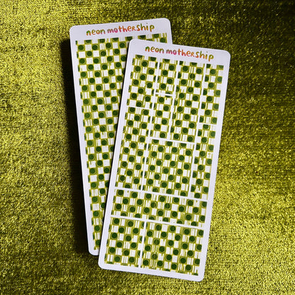 Two green and white checkered sticker sheets with 'neon mothership' text on a green textured background