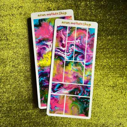 Two colorful abstract sticker sheets with 'neon mothership' branding on a green textured background.