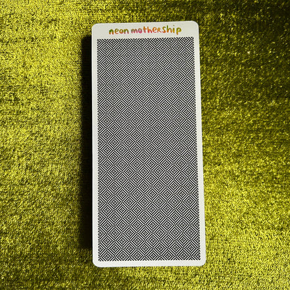 sticker sheet with geometric pattern on a textured green surface