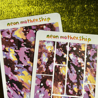 Two sticker sheet with 'neon mothership' text on a green textured background