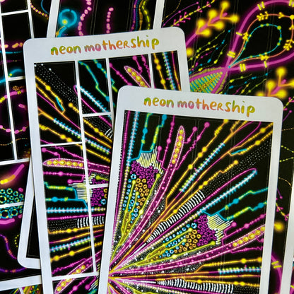 Colorful abstract sticker sheets with 'neon mothership' text on a black background