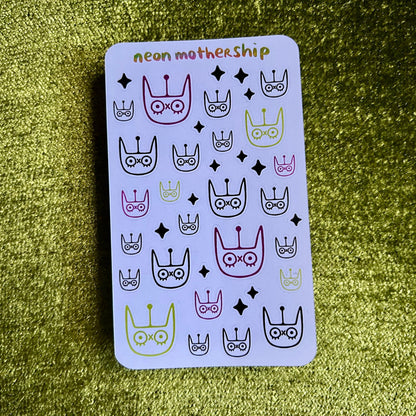 Card with colorful designs on a green textured surface