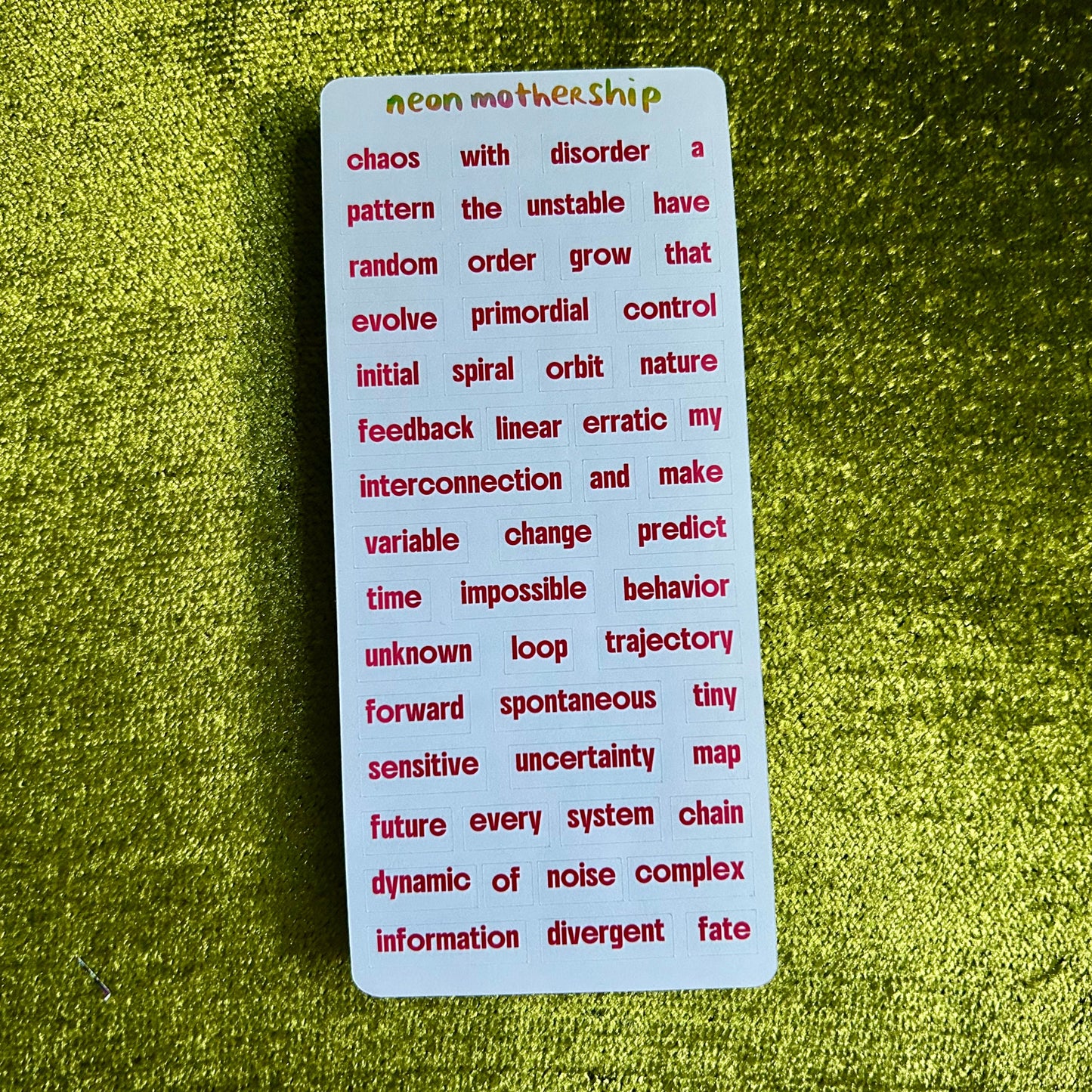 Card with text on a green textured surface