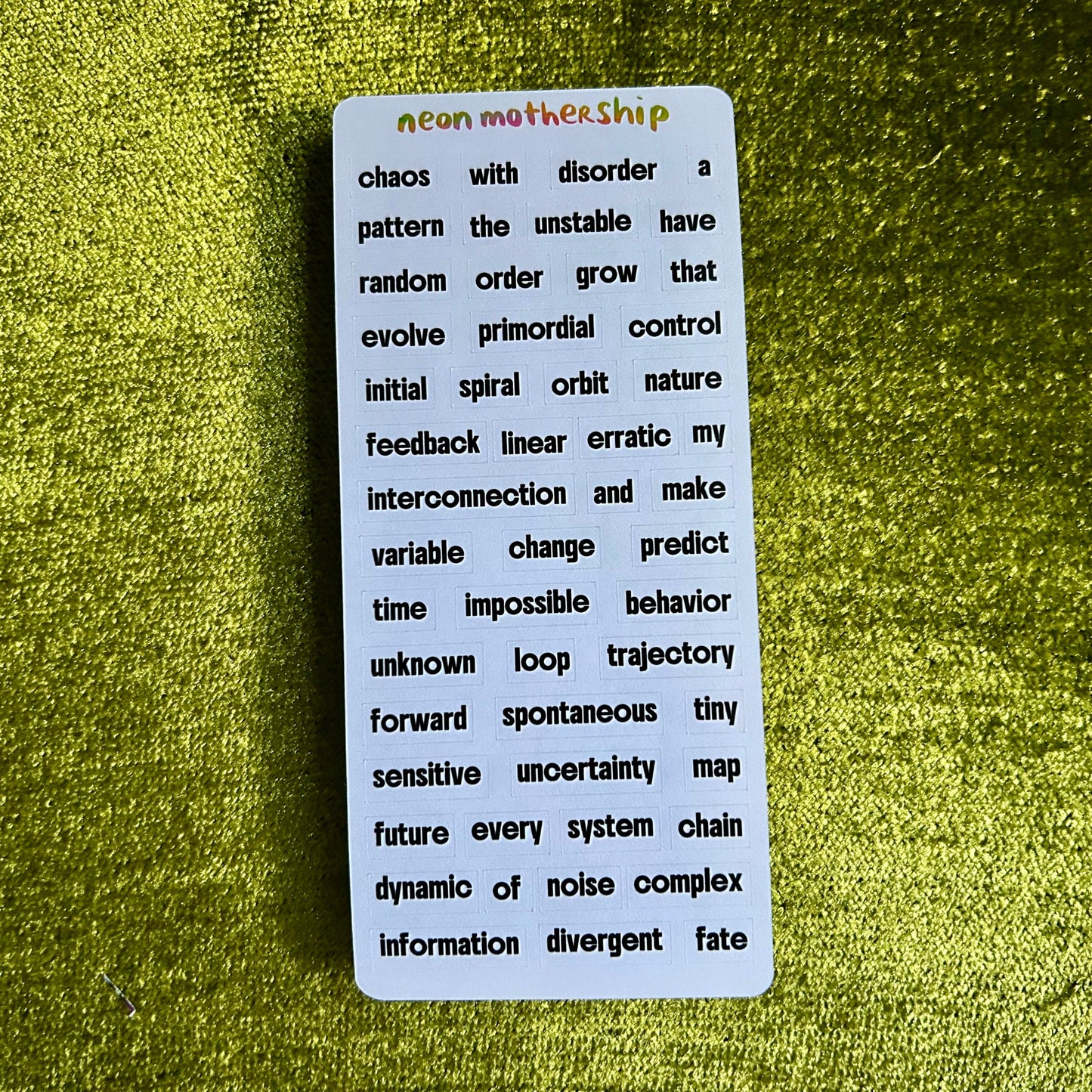 Text card with philosophical text on a green textured surface