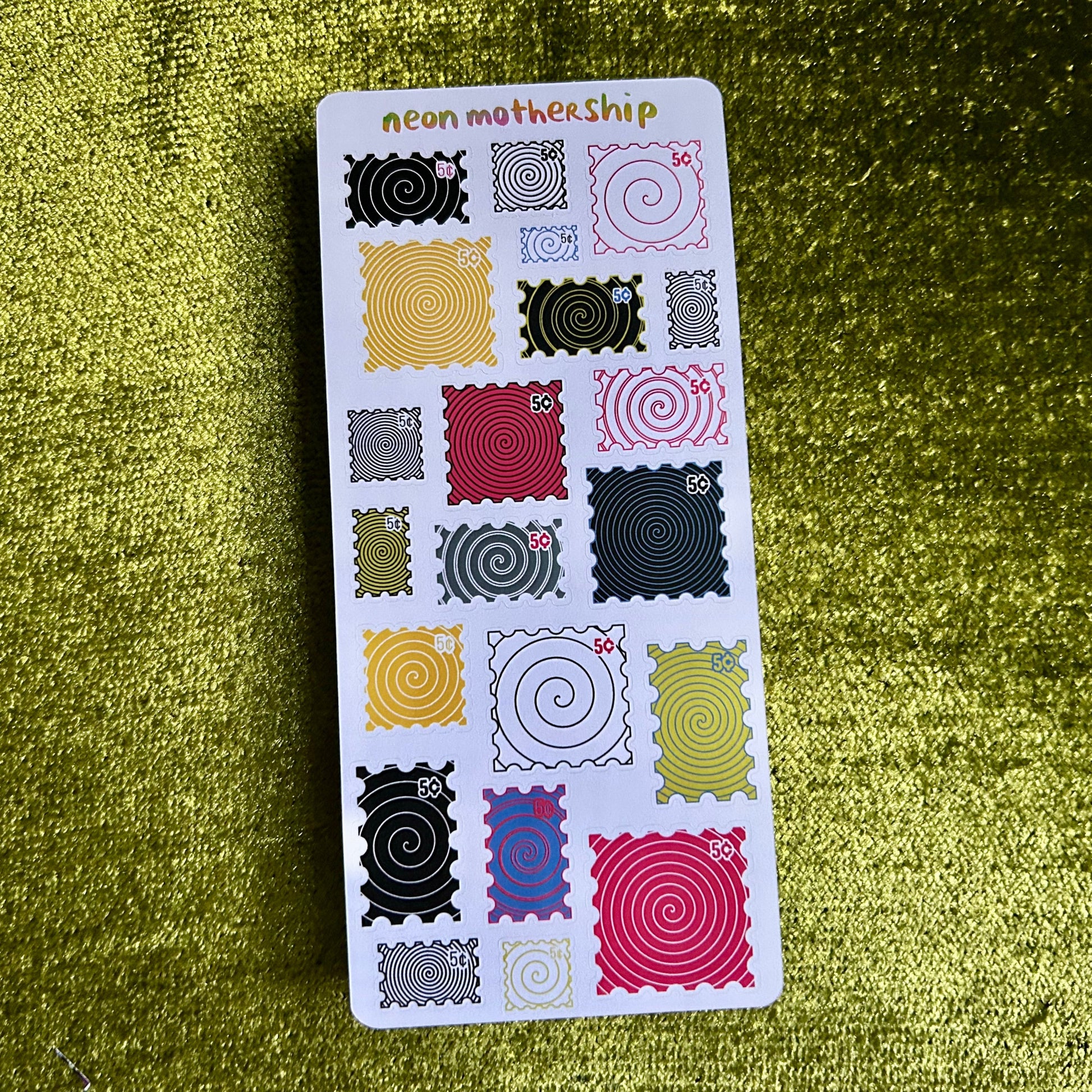 Sticker sheet with various patterns on a green textured background
