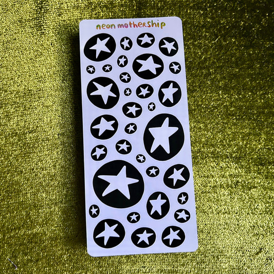 Sheet of star-shaped stickers with 'neon mothership' branding on a green textured background