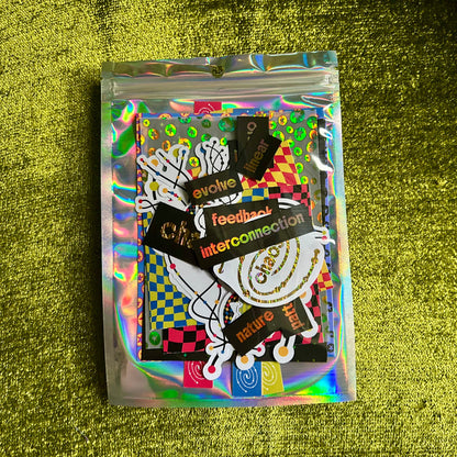 Holographic packaging with stickers on a green textured background