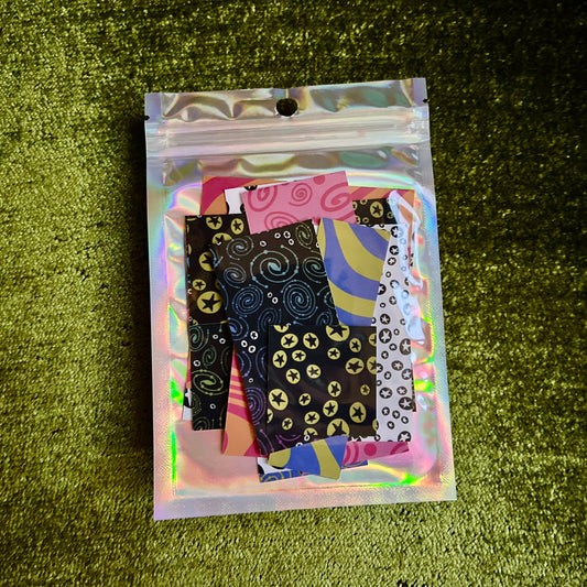 Packaged product with colorful patterns on a green textured surface