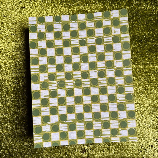 sticker sheet with green and white geometric pattern on a green textured background