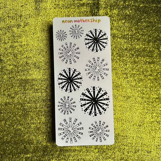 sticker sheet with paper starburst stickers on a green background