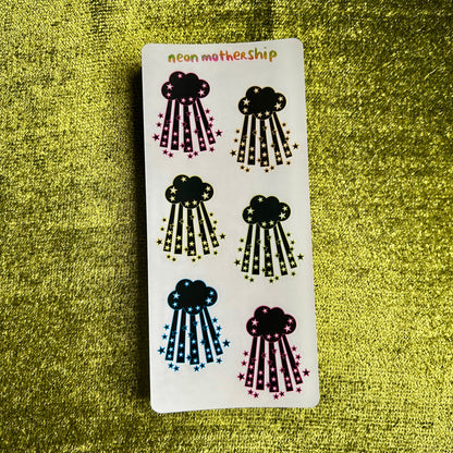 Sticker sheet with cloud designs on a green textured background