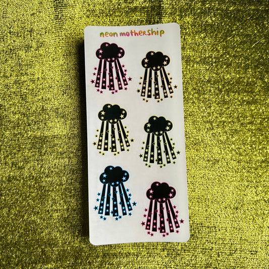 Sticker sheet with cloud designs on a green textured background