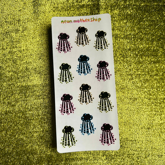 paper cloud sticker sheet on a green textured background