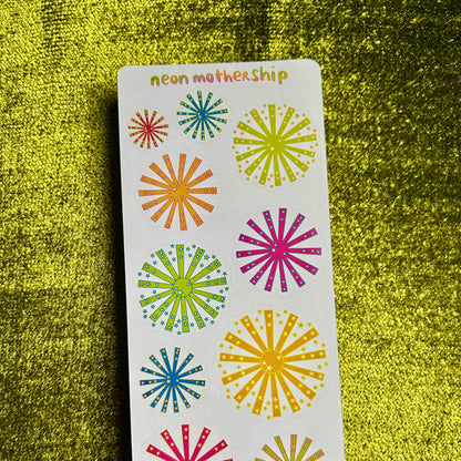 Card with colorful sunburst designs on a green textured background