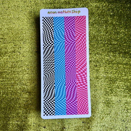 Colorful checkered sticker sheet with 'neon mothership' text on a green textured surface