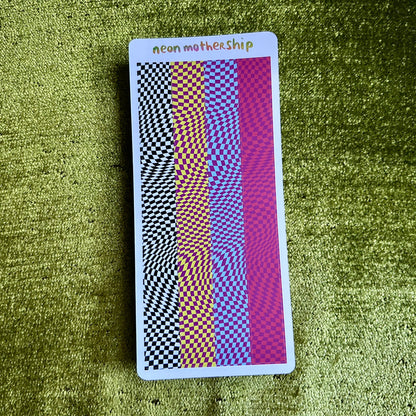 sticker sheet with geometric pattern on a green textured surface