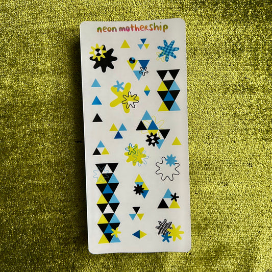 Sticker sheet with geometric patterns on a green textured background