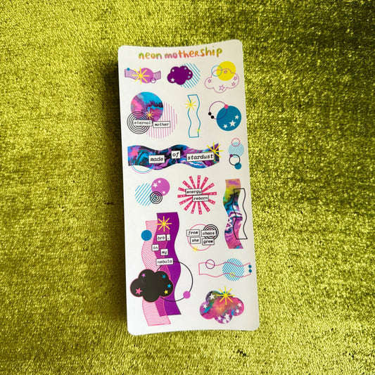 Sticker sheet with colorful designs on a green textured surface