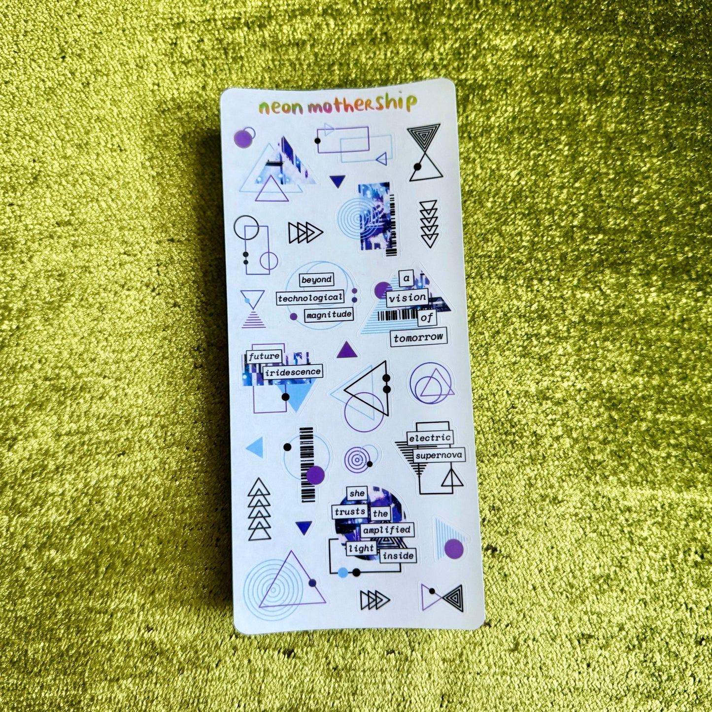 Sticker sheet with geometric designs on a green textured surface