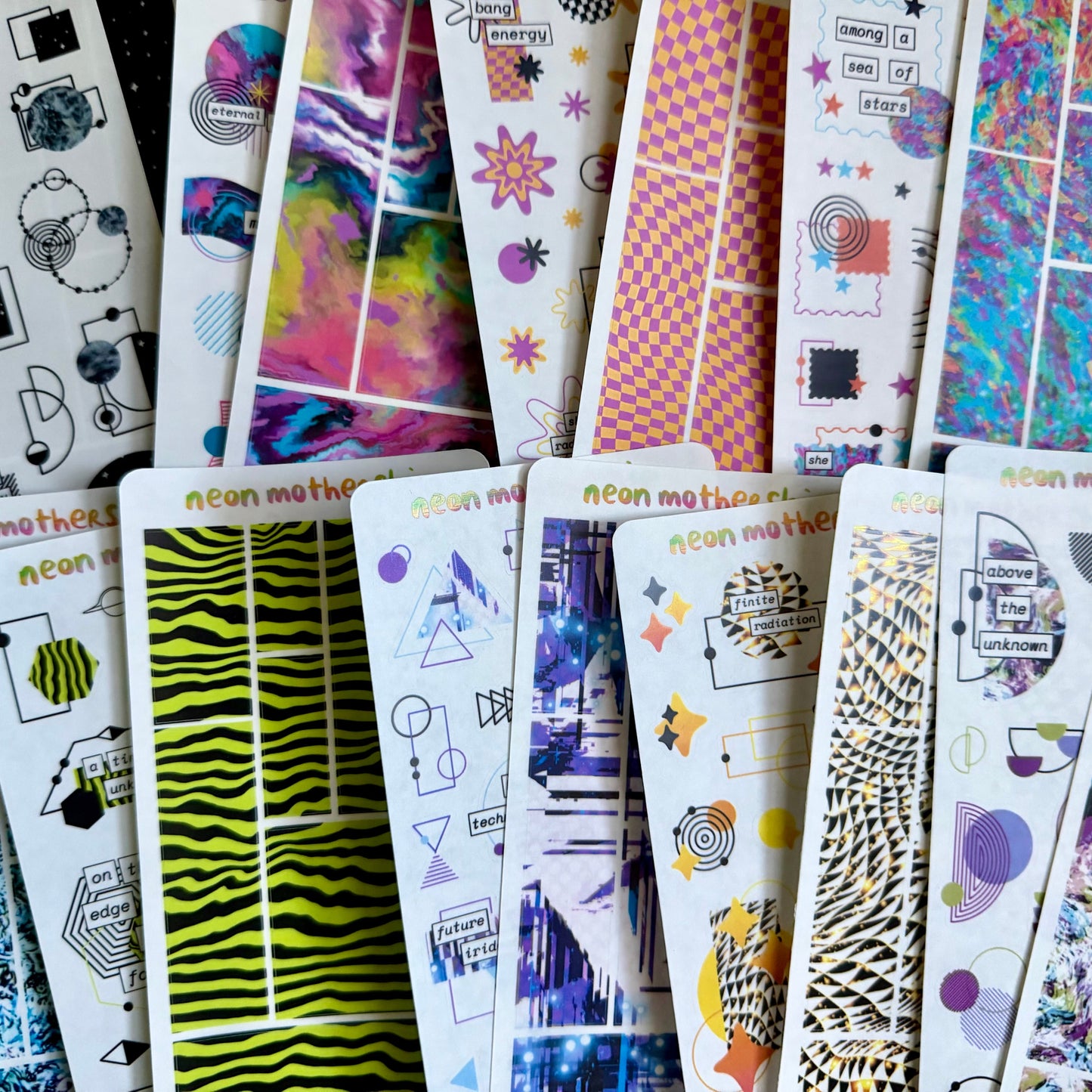 Collection of colorful sticker sheets with various designs on a white background