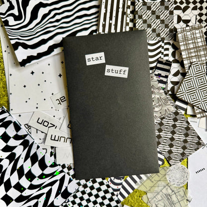 Black envelope with 'star stuff' text surrounded by various black and white patterned papers on a green background