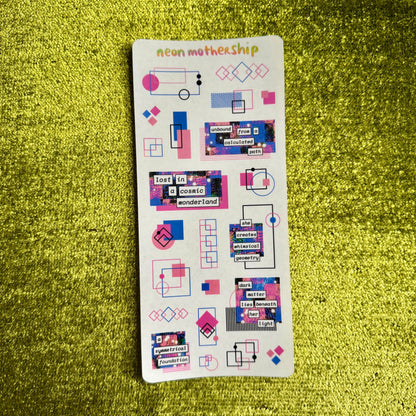 Sheet of colorful stickers with geometric designs on a green textured surface