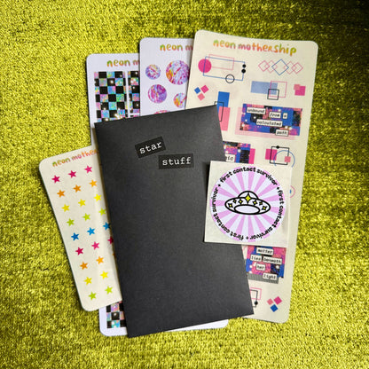 Set of colorful stickers on a green textured surface