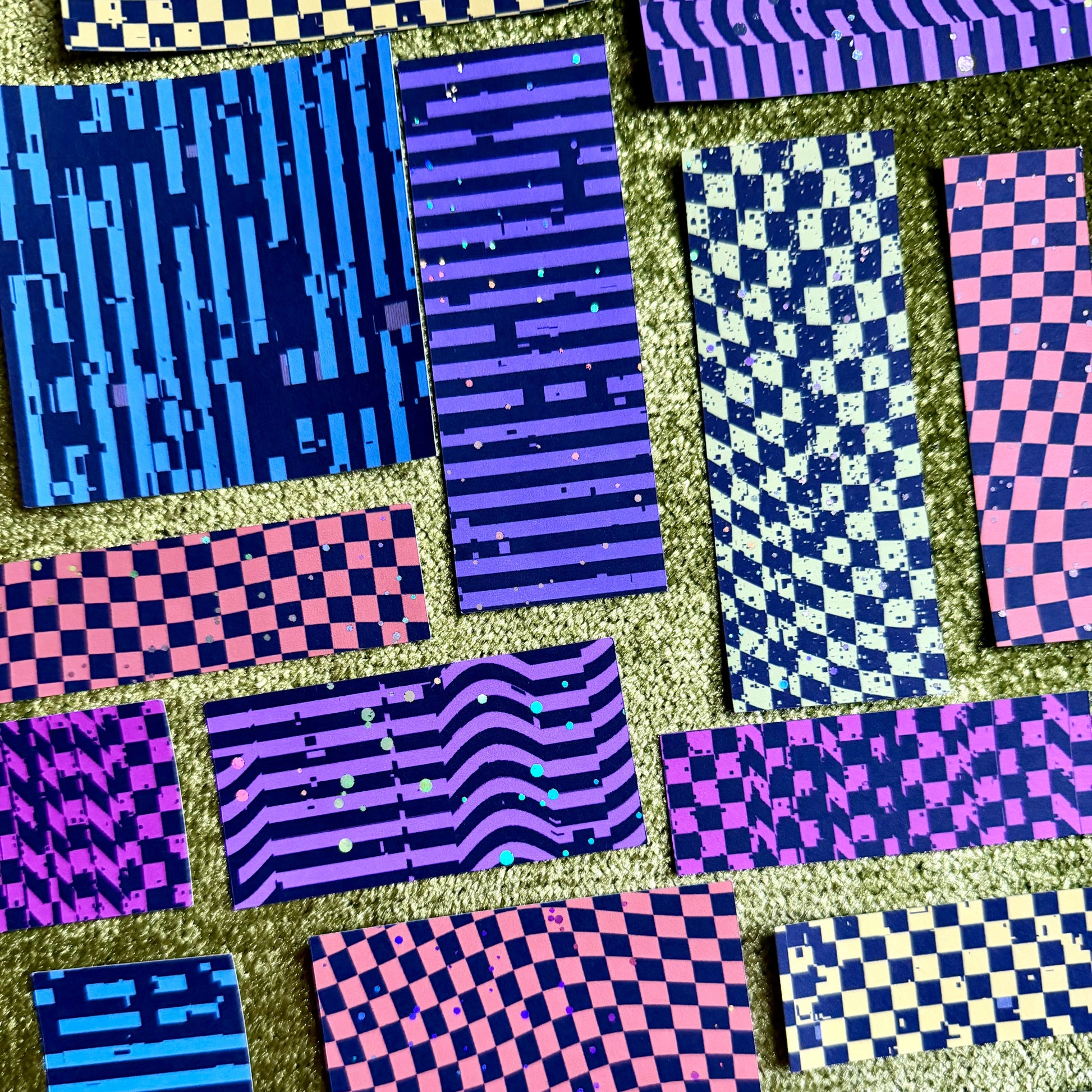 bright colorful sticker scraps on a green background