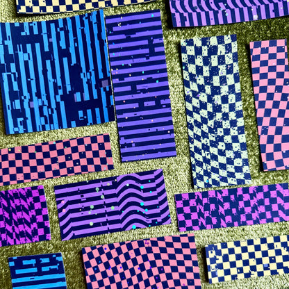 bright colorful sticker scraps on a green background
