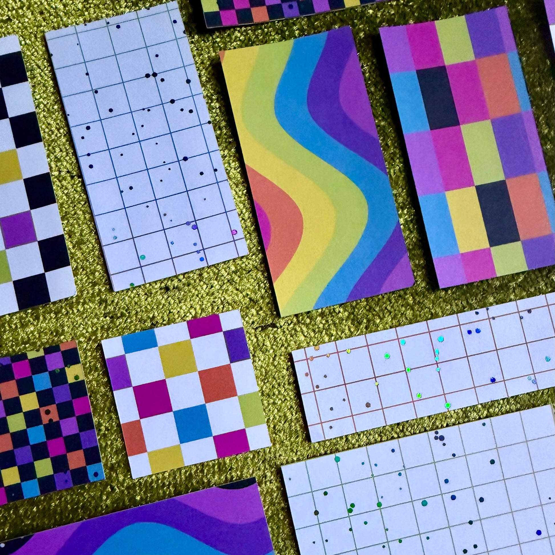 colorful sticker scraps on a green background