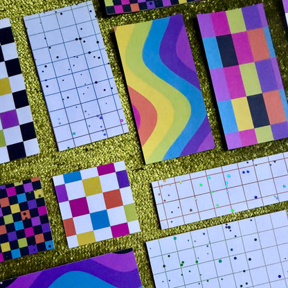 colorful sticker scraps on a green background