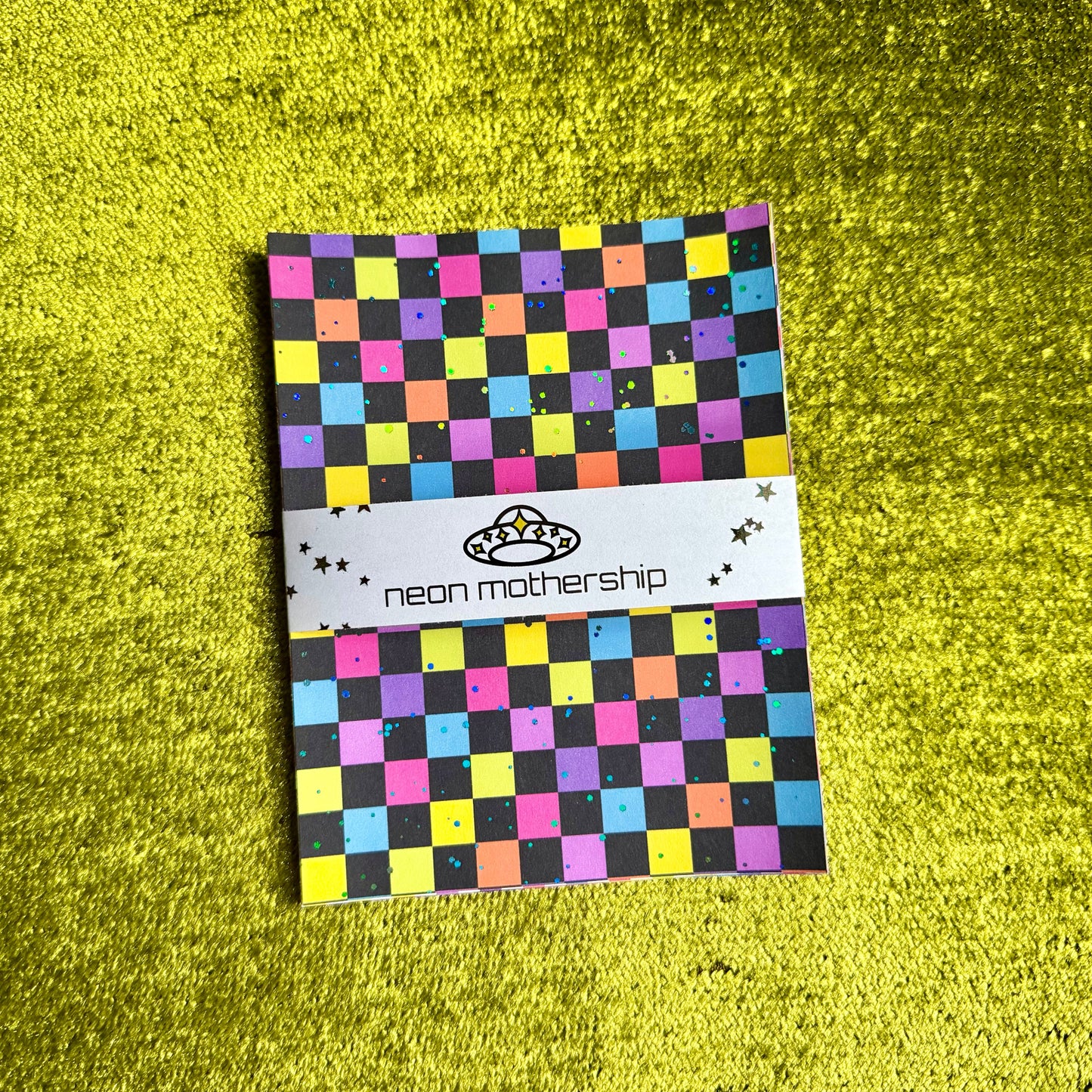 checkered sticker sheets on a green background