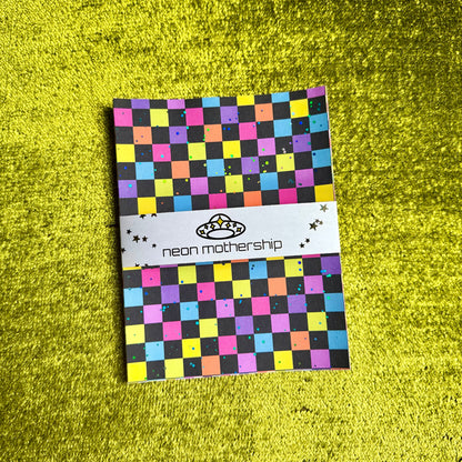 checkered sticker sheets on a green background