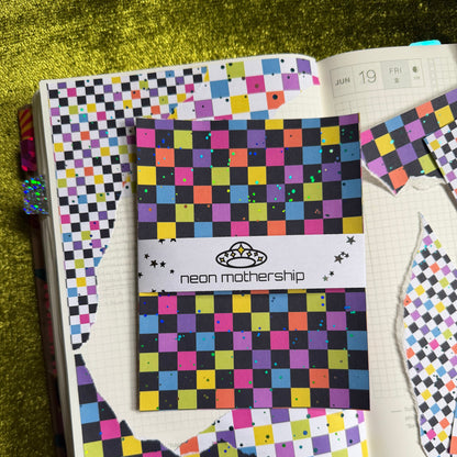 sticker sheets on a colorful journal page