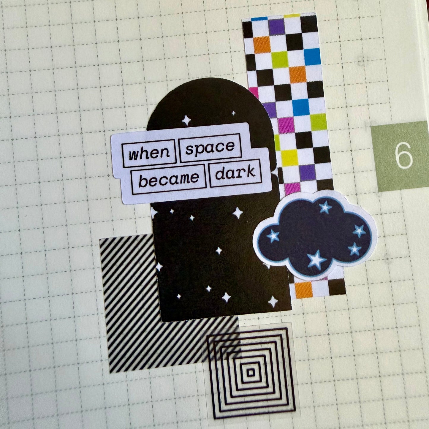 stickers arranged in a collage on a journal page