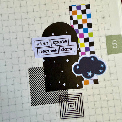 stickers arranged in a collage on a journal page