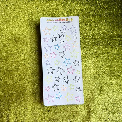 sheet of star stickers on a green background