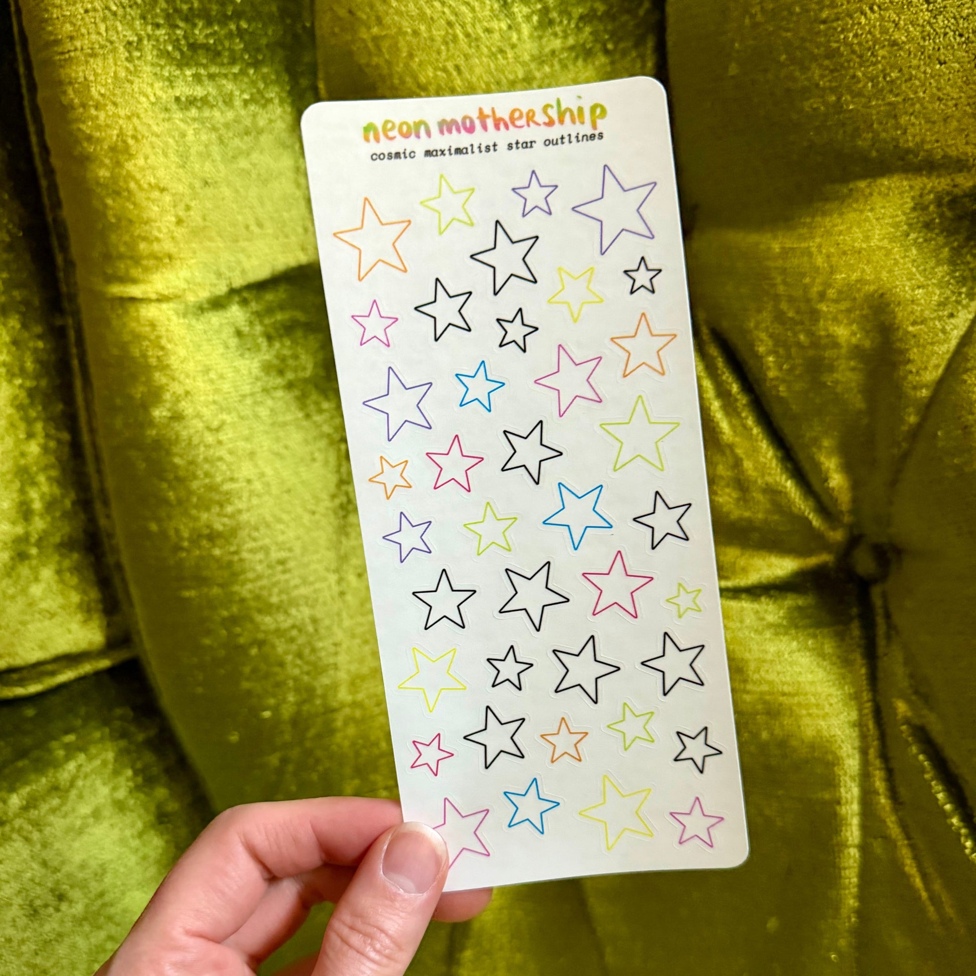 single sheet of star stickers on a green background