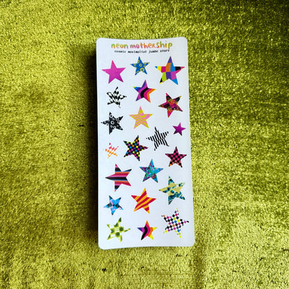 Pack of star-shaped stickers on a green textured surface