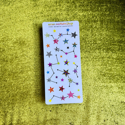 sticker sheet with star designs on a green textured surface
